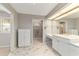 Elegant bathroom with double vanity and marble flooring at 1133 Se 24Th Ter, Ocala, FL 34471