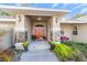 Welcoming entryway with red double doors and stone accents at 1133 Se 24Th Ter, Ocala, FL 34471