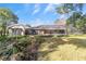 House exterior with a pool and screened enclosure in the backyard at 1133 Se 24Th Ter, Ocala, FL 34471