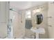 Clean bathroom with pedestal sink and shower/tub combo at 114 Ne 11Th Ave, Ocala, FL 34470