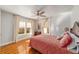 Bright bedroom with hardwood floors, a ceiling fan, and lots of natural light at 114 Ne 11Th Ave, Ocala, FL 34470