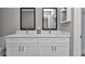 This bathroom features dual sinks, quartz counters, and a mirror above each sink at 13787 Sw 43Rd Cir, Ocala, FL 34473