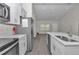 Open kitchen featuring white cabinetry, stainless steel appliances, and lots of counter space at 13787 Sw 43Rd Cir, Ocala, FL 34473