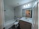 Clean bathroom with modern fixtures including a shower, tub and vanity with sink at 14259 Se 33Rd Ter, Summerfield, FL 34491