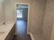 Bathroom featuring a large marble tile shower and a double sink vanity at 14259 Se 33Rd Ter, Summerfield, FL 34491