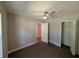 Well-lit bedroom showcasing wood-look floors and a closet at 14259 Se 33Rd Ter, Summerfield, FL 34491