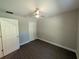 Bedroom boasts wood-look floors, neutral walls, and ample closet space at 14259 Se 33Rd Ter, Summerfield, FL 34491