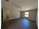 Bright bedroom with stylish wood-look flooring and a window view at 14259 Se 33Rd Ter, Summerfield, FL 34491