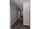 Clean hallway with gray walls and dark gray flooring at 14259 Se 33Rd Ter, Summerfield, FL 34491