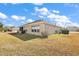 View of the back of the house and surrounding yard at 14315 Se 85Th Ave, Summerfield, FL 34491