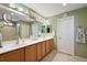 Large bathroom with double sinks and a walk-in shower at 14315 Se 85Th Ave, Summerfield, FL 34491