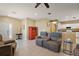 Open living room with tile flooring and a view of the kitchen at 14315 Se 85Th Ave, Summerfield, FL 34491