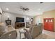 Living room with neutral walls, tile floor, and reclining furniture at 14315 Se 85Th Ave, Summerfield, FL 34491