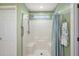 Walk-in shower with a built-in seat at 14315 Se 85Th Ave, Summerfield, FL 34491