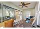 Sunroom with sliding doors and view into the kitchen at 14315 Se 85Th Ave, Summerfield, FL 34491