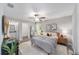 Main bedroom with ceiling fan and ensuite bathroom at 15298 Sw 43Rd Avenue Rd, Ocala, FL 34473