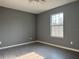 Bright bedroom with large window and tile floors at 15801 Sw 37Th Cir, Ocala, FL 34473