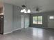 Bright living room featuring tile floors and ceiling fan at 15801 Sw 37Th Cir, Ocala, FL 34473