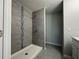 Clean shower with grey tile, mosaic accents and large shower head at 15801 Sw 37Th Cir, Ocala, FL 34473