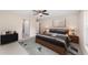 Main bedroom with wood bed frame, neutral color scheme, and carpet flooring at 17715 Sw 113Th Pl, Dunnellon, FL 34432