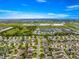 Beautiful aerial view of the home in a well-maintained community, close to shopping and amenities at 2418 Hopespring Loop, The Villages, FL 32162