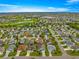 Panoramic aerial shot showcasing the home's location in a lush community with golf course nearby at 2418 Hopespring Loop, The Villages, FL 32162