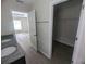 Bathroom with double vanity and linen closet at 2792 Sw 161St Loop, Ocala, FL 34473