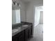 A double-sink bathroom vanity with granite countertops providing ample counter space at 2792 Sw 161St Loop, Ocala, FL 34473