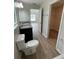 Bright bathroom featuring a double sink vanity and wood-look floors at 2792 Sw 161St Loop, Ocala, FL 34473