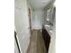 Bathroom with a tiled shower, granite counters, and wood-look floors at 2792 Sw 161St Loop, Ocala, FL 34473
