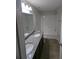 Bathroom with granite countertop, double vanity, and subway tile shower at 2792 Sw 161St Loop, Ocala, FL 34473