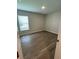 Bright bedroom with wood-look floors, natural light, and neutral walls at 2792 Sw 161St Loop, Ocala, FL 34473