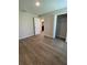 Spacious bedroom featuring wood flooring, a walk-in closet, and an ensuite bathroom providing convenience and privacy at 2792 Sw 161St Loop, Ocala, FL 34473