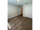 Cozy bedroom featuring wood-look floors and a spacious closet at 2792 Sw 161St Loop, Ocala, FL 34473