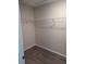 Walk-in closet area with clothes rack on top and a wood floor at 2792 Sw 161St Loop, Ocala, FL 34473