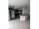 Spacious kitchen area with sleek appliances, dark wood cabinets, and a granite kitchen island at 2792 Sw 161St Loop, Ocala, FL 34473