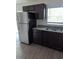 Stainless steel appliances and dark brown cabinets in the kitchen at 2792 Sw 161St Loop, Ocala, FL 34473