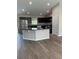 Open concept kitchen with granite island and stainless steel appliances at 2792 Sw 161St Loop, Ocala, FL 34473