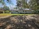 Spacious backyard with a pergola and grassy area at 3333 Se 12Th St, Ocala, FL 34471