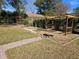 Landscaped backyard with pergola, fire pit, and water feature at 3333 Se 12Th St, Ocala, FL 34471