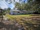 Large backyard with a patio and mature trees at 3333 Se 12Th St, Ocala, FL 34471