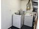 Laundry room with washer, dryer, and storage shelves at 3333 Se 12Th St, Ocala, FL 34471