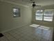 Living room with tile floors and large windows at 3333 Se 12Th St, Ocala, FL 34471