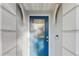 Close-up of a blue front door with decorative glass and modern hardware at 35428 Crescent Dr, Fruitland Park, FL 34731