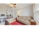 Comfortable living room featuring neutral tones, an open floor plan, and a decorative red rug at 35428 Crescent Dr, Fruitland Park, FL 34731