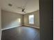 Bright bedroom with vinyl plank flooring and a large window at 3957 Se 137Th Ln, Summerfield, FL 34491