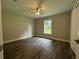 Bright bedroom featuring wood-look floors and a window at 3957 Se 137Th Ln, Summerfield, FL 34491