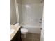 Clean bathroom with tub, toilet and granite countertop at 40 Juniper Trl, Ocala, FL 34480