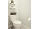 Small bathroom with toilet and floating shelves at 4321 Sw 52Nd Lane Rd, Ocala, FL 34474