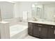 Elegant bathroom with soaking tub, double vanity, and upgraded finishes at 4321 Sw 52Nd Lane Rd, Ocala, FL 34474